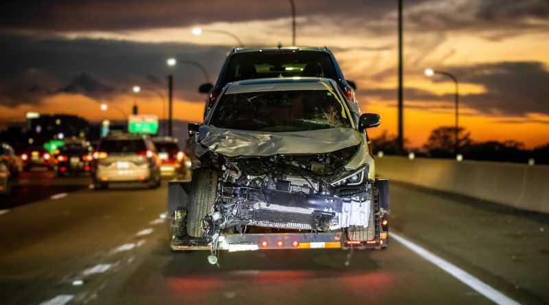 wrecked-car-crash-accident-highway-towing-trailer-freeway